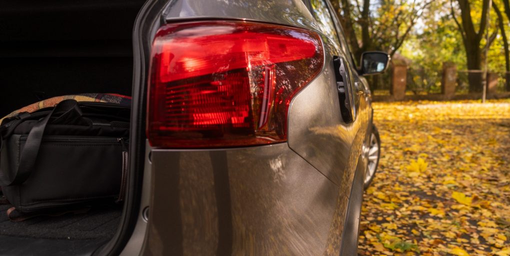 Autumn Scene with Gray Car and Leaves close up
